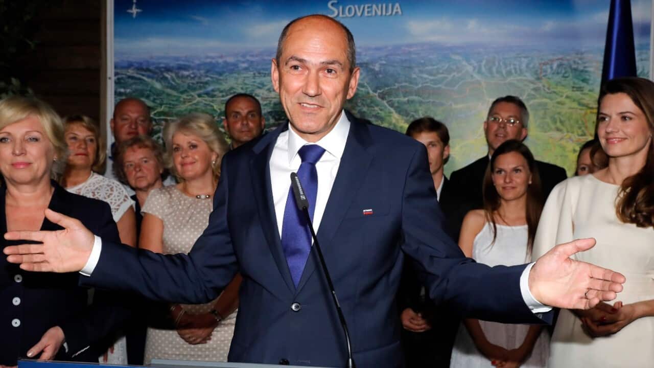 Janez Jansa (C), President of the SDS (Slovenian Democratic Party) and candidate for the snap parliamentary elections talks to the media