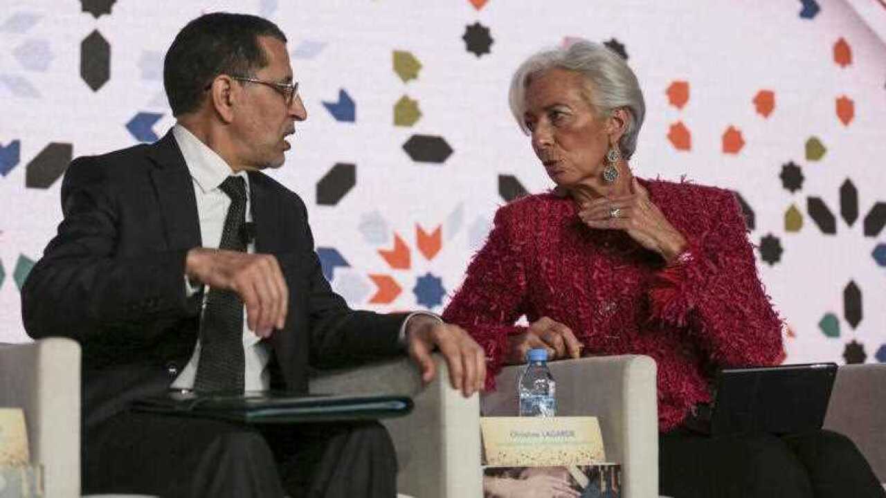 Christine Lagarde, Managing Director of International Monetary Fund IMF, right, speaks to Morocco's Prime Minister Saad-Eddine El Othmani, left,