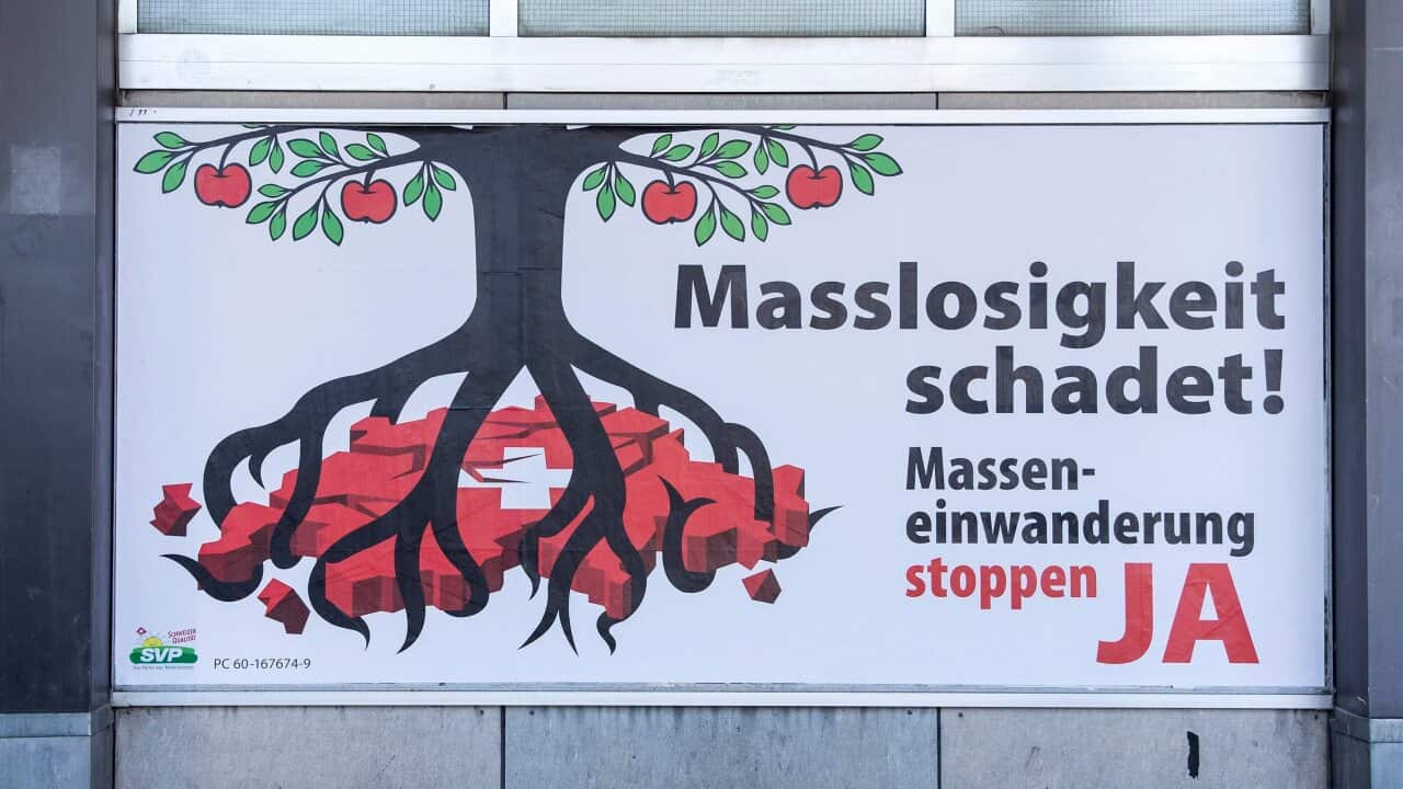 A sign supporting the initiative against mass immigration, reading 'Excess harms' - AAP-1.jpg