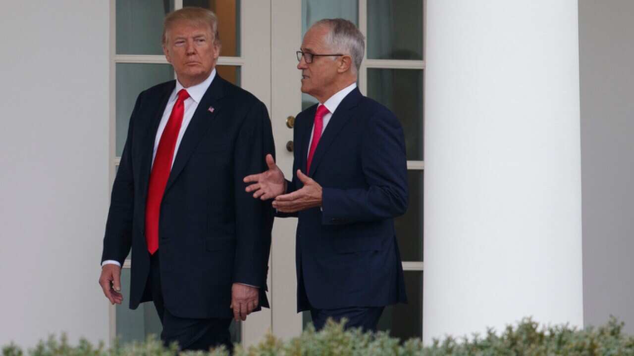 President Donald Trump and Australian Prime Minister Malcolm Turnbull walk along the colonnade to the Oval Office of the White House in Washington, Friday, Feb. 23, 2018. (AP Photo/Carolyn Kaster)