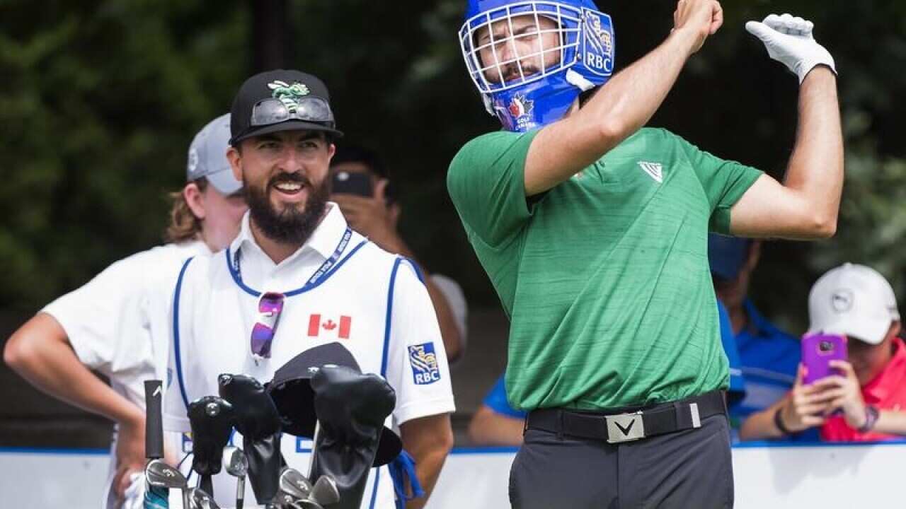 Adam Hadwin, of Canada, attempts to practice his tee shot.