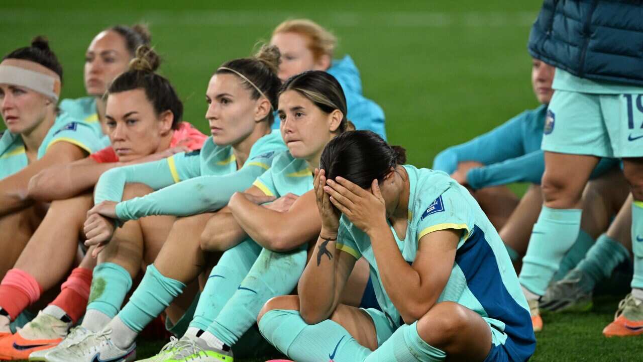 Players react after losing the game.
