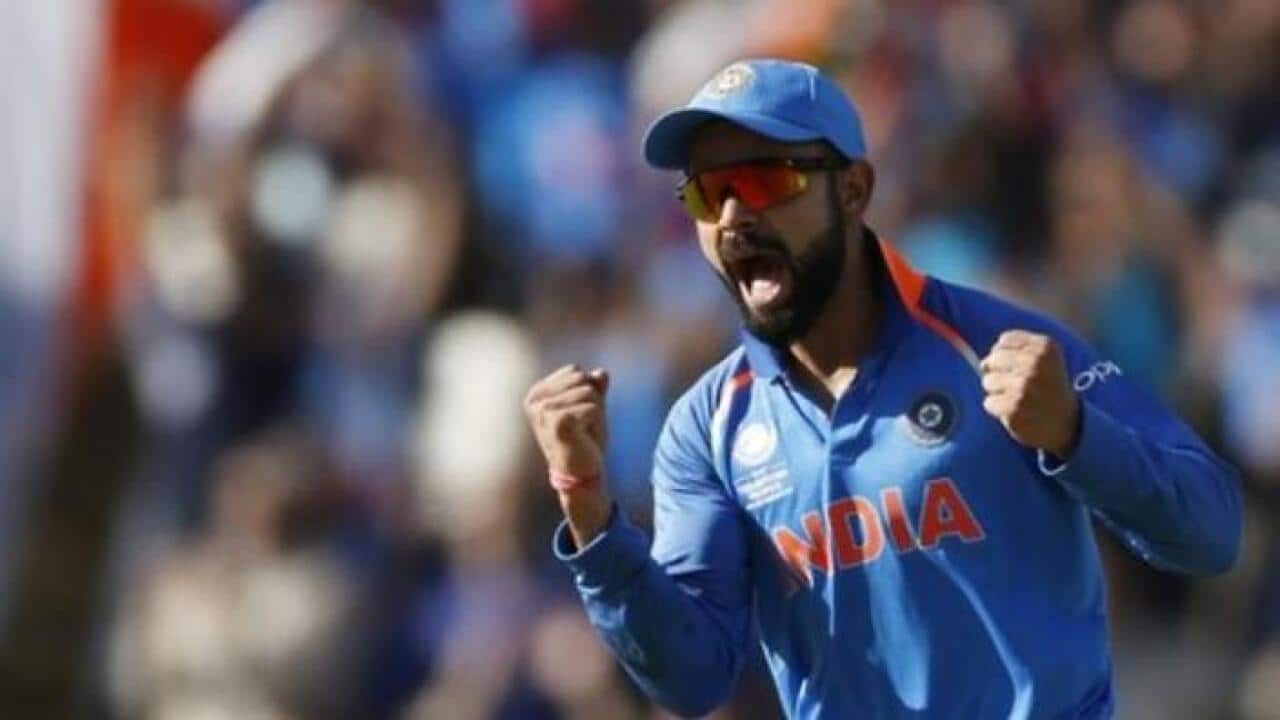 Indias Virat Kohli celebrates the wicket of Pakistans Azhar Ali