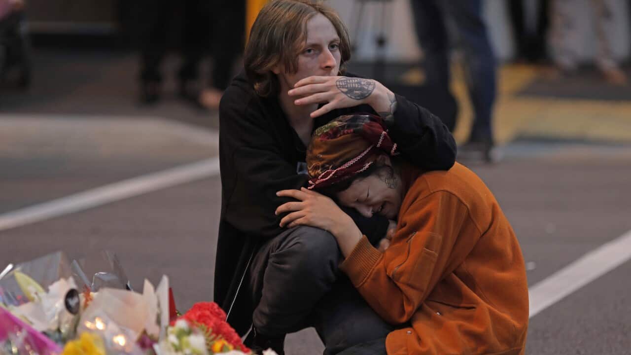 Mourners pay their respects at a makeshift memorial near the Masjid Al Noor mosque (AAP).jpg