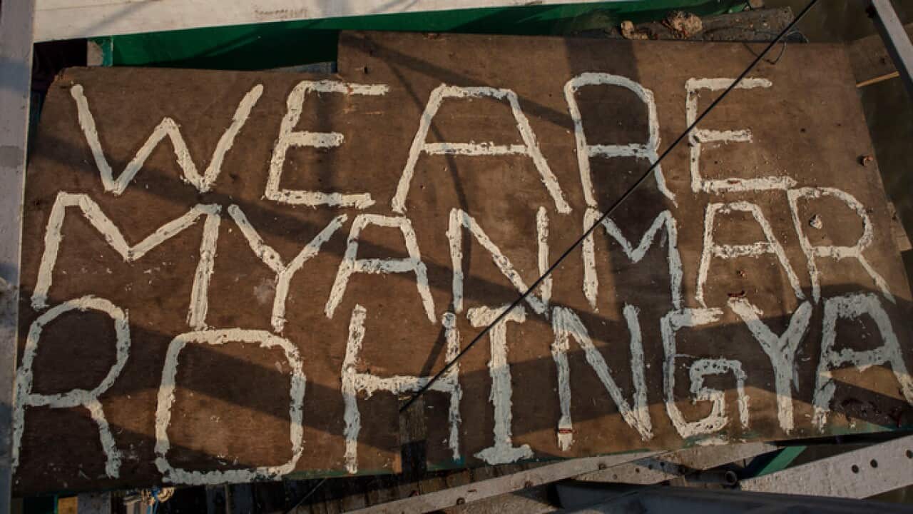 A sign found on an abandoned boat which had been used to carry people from Myanmar and Bangladesh, Aceh Province, Indonesia