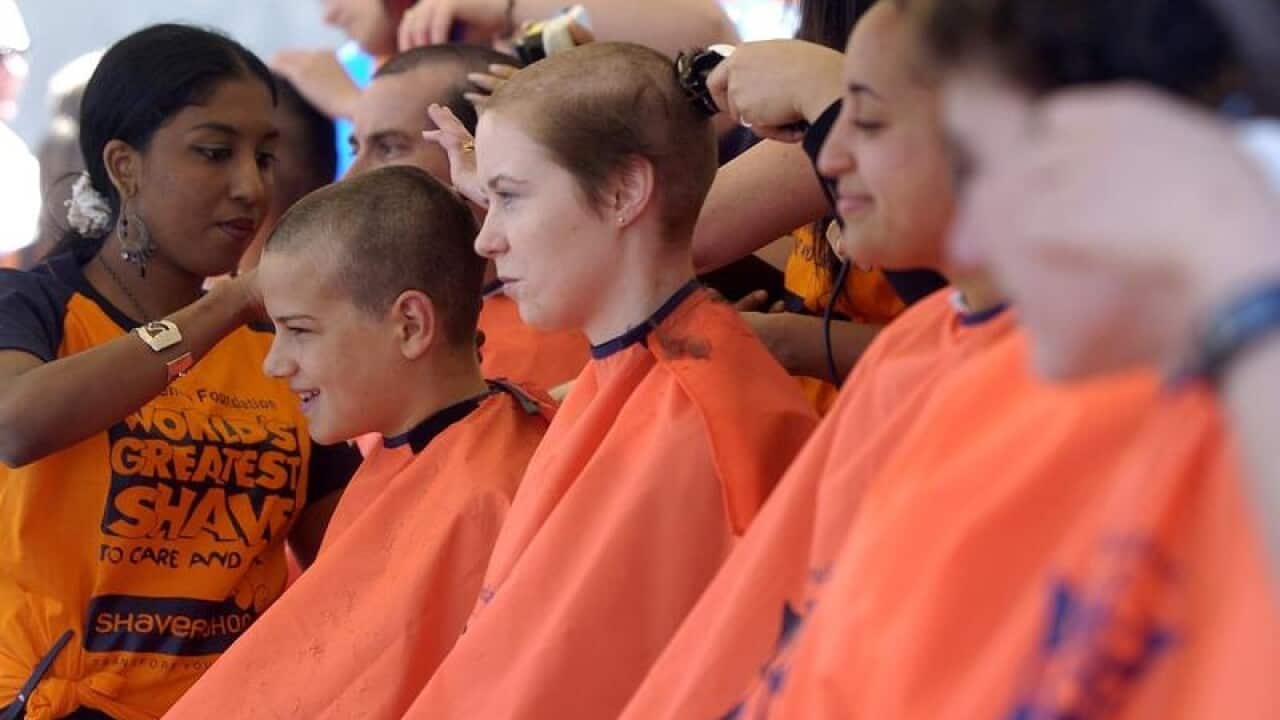 People have their heads shaved at the World's Greatest Shave