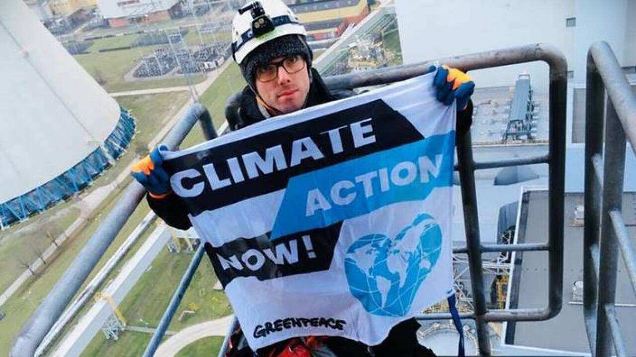 Greenpeace activist who climbed a 180m chimney ahead of Poland's climate summit.