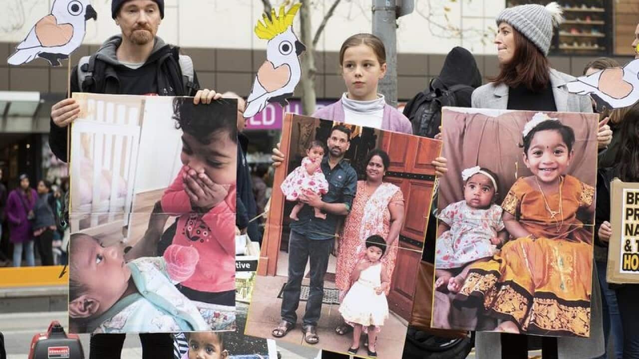 Supporters of a Tamil asylum seeker family being held in custody.
