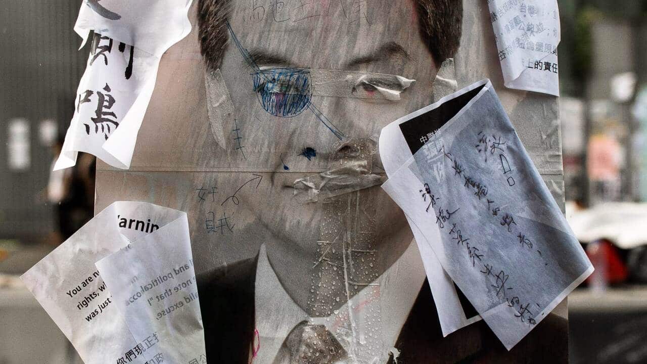 A defaced placard of Hong Kong Chief executive Leung Chun-ying