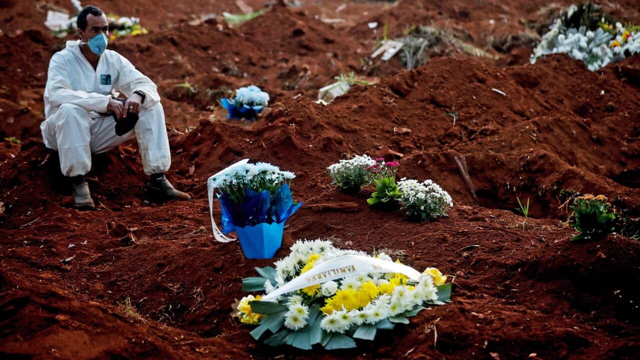 A gravedigger rests in the Vila Formosa cemetery (AAP)