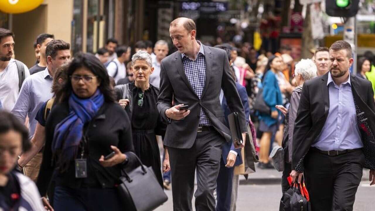 People are seen walking in the Melbourne CBD