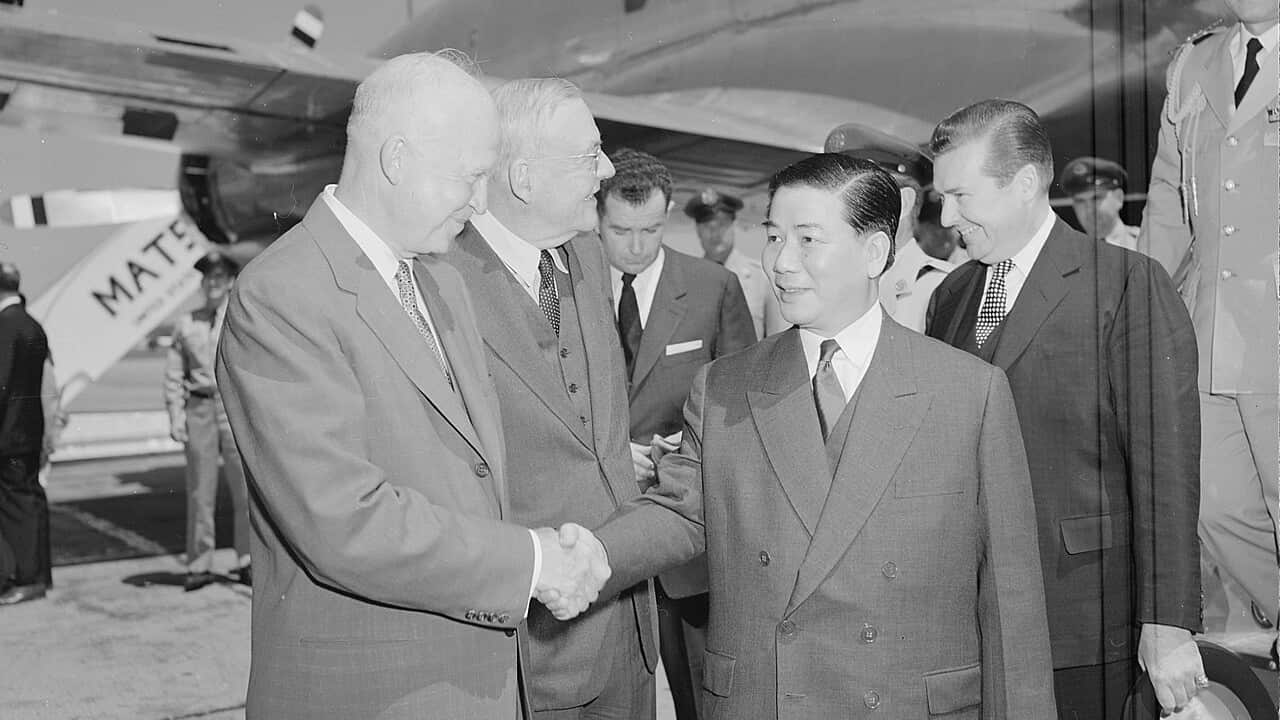 U.S. President Dwight D. Eisenhower and Secretary of State John Foster Dulles greet South Vietnamese President Ngô Đình Diệm at Washington National Airport.