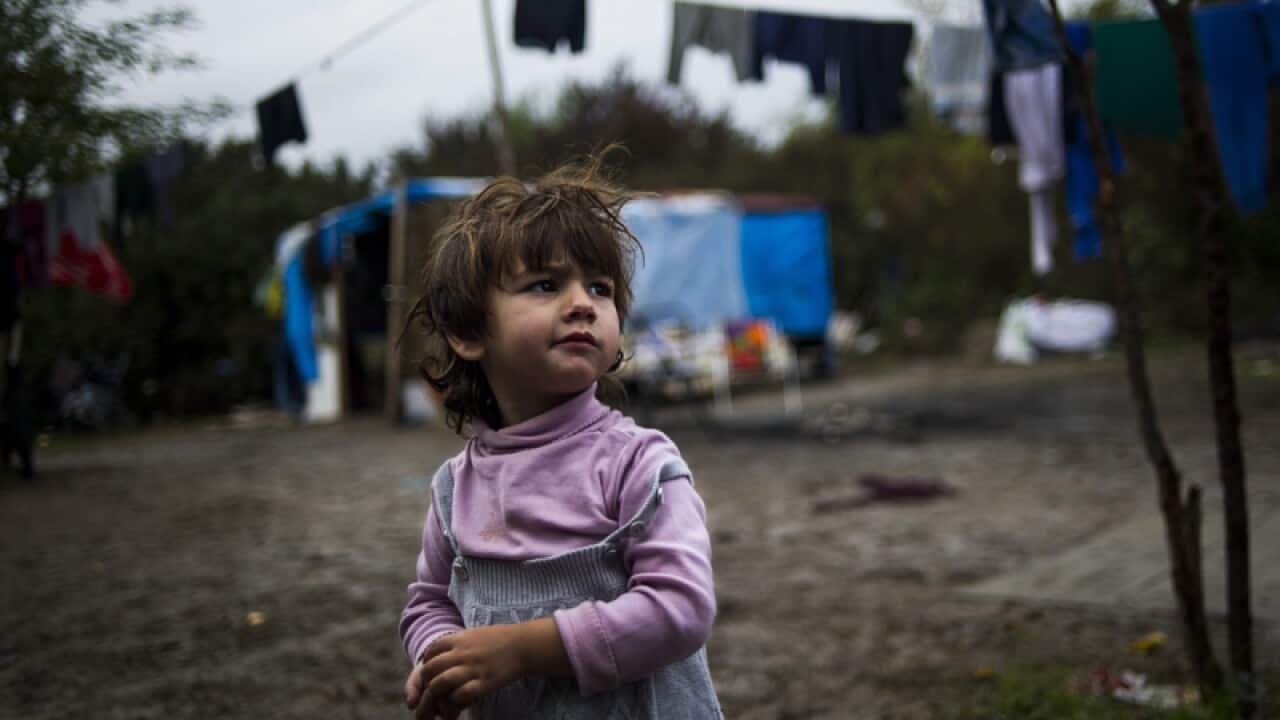 A little girl in a Roma camp east of Paris