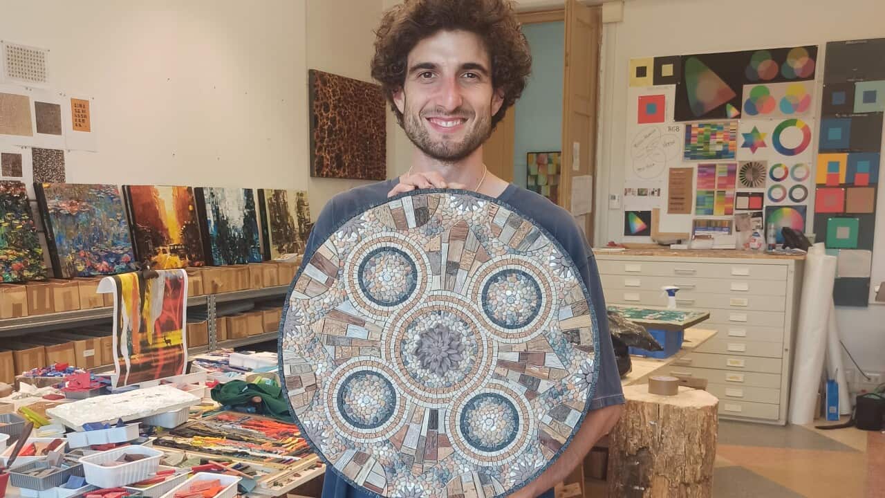 Umberto Pepe holding one of his creations