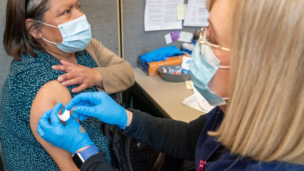 A Registered Nurse gives the first dose of the coronavirus vaccine to a patient in New York on Thursday, 18 February, 2021.