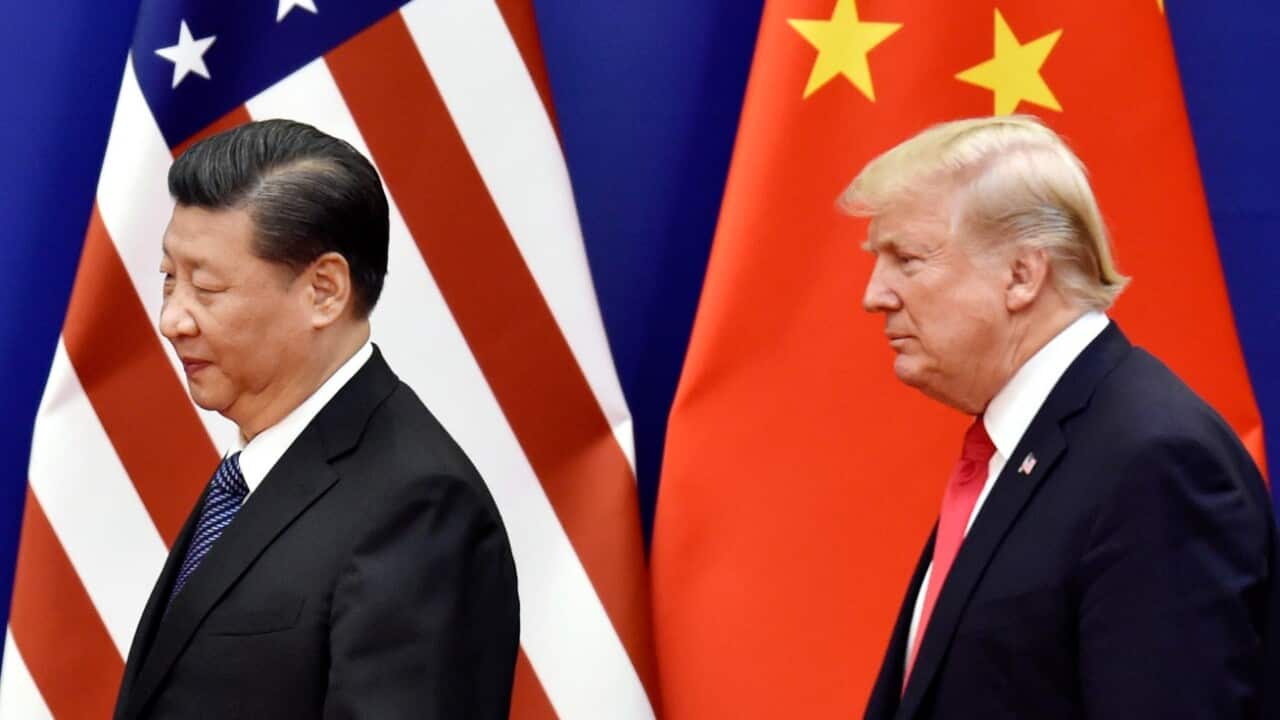File photo taken in November 2017 shows U.S. President Donald Trump (R) and Chinese President Xi 