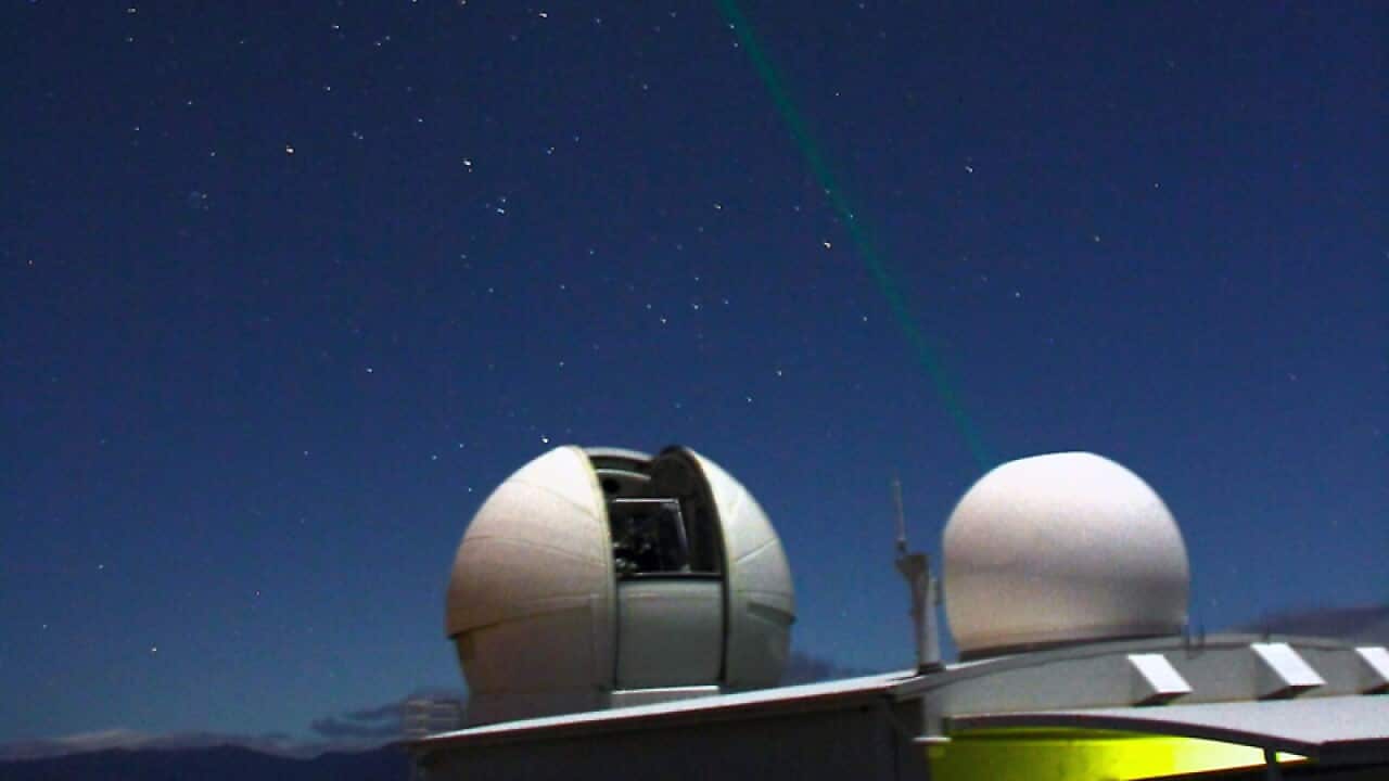 A telescope tracking a space debris object.