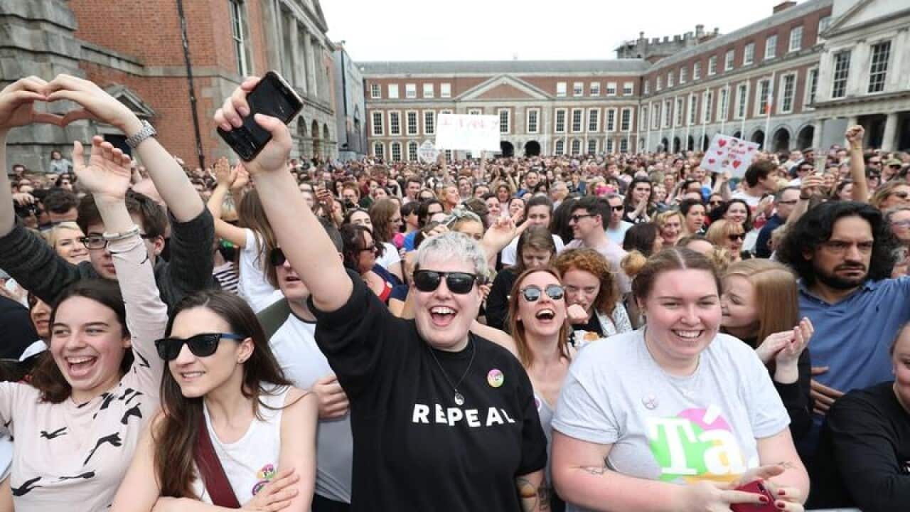 Campaigners wait at Dublin Castle for the official result