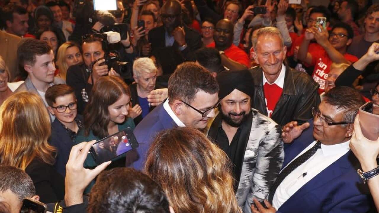 Victorian Premier Daniel Andrews being mobbed by supporters.