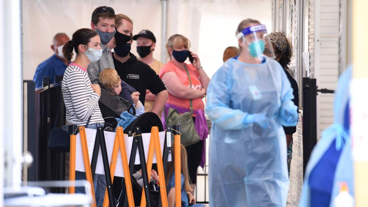 People are seen waiting in line at the Goulburn Valley Health-Mcintosh Covid19 testing facility in Shepparton, Victoria.