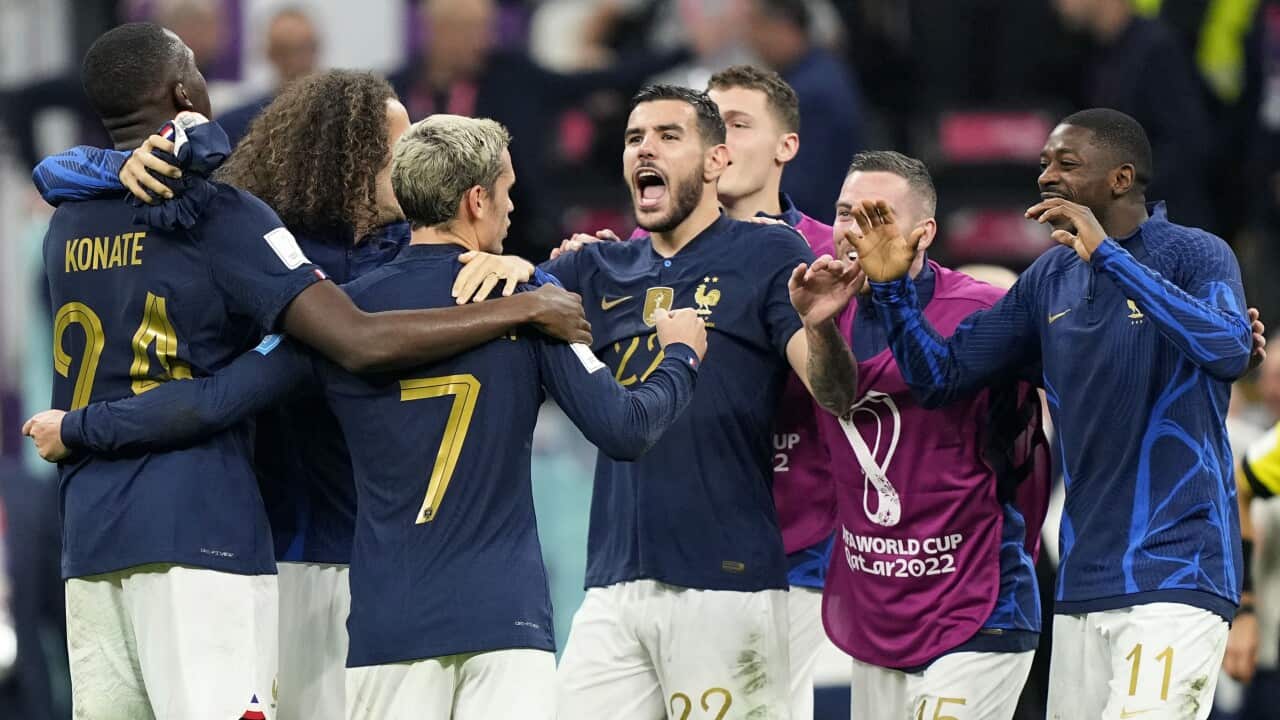 France's Theo Hernandez, center, celebrates with team mates after the World Cup semifinal soccer match between France and Morocco at the Al Bayt Stadium in Al Khor, Qatar