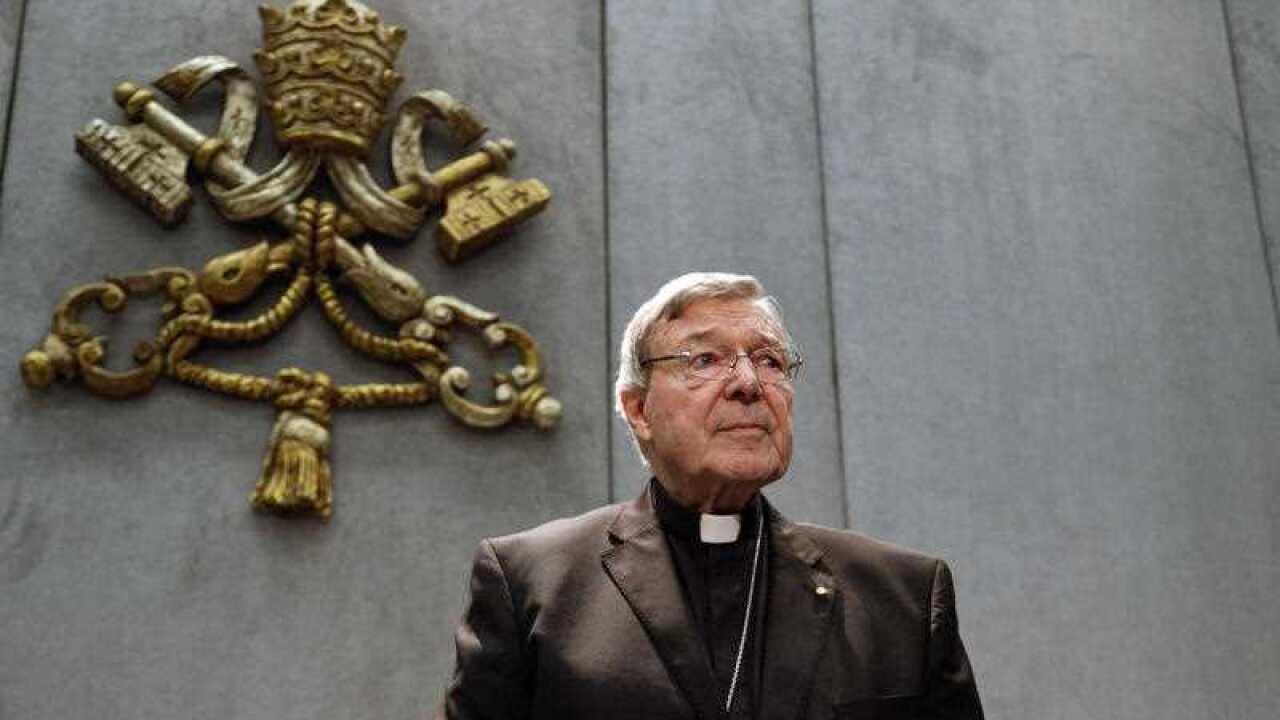 In this Thursday, June 29, 2017. file photo, Cardinal George Pell prepares to make a statement, at the Vatican.