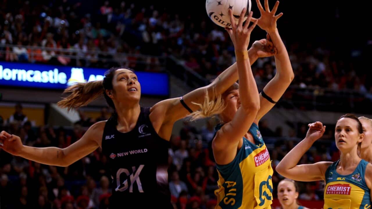 NZ Phoenix Karaka (L) and Caitlin Bassett compete for the ball
