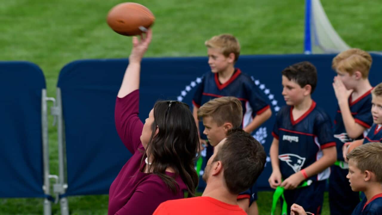 Sarah Huckabee Sanders throws a football with kids at the White House