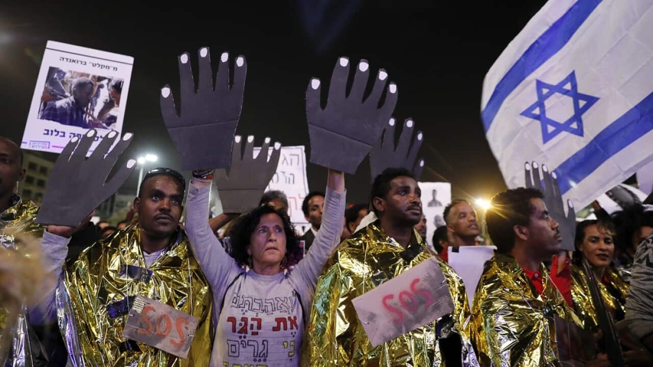 Thousands take part in a demonstration in Tel Aviv to protest against the government's decision to deport African asylum seekers.