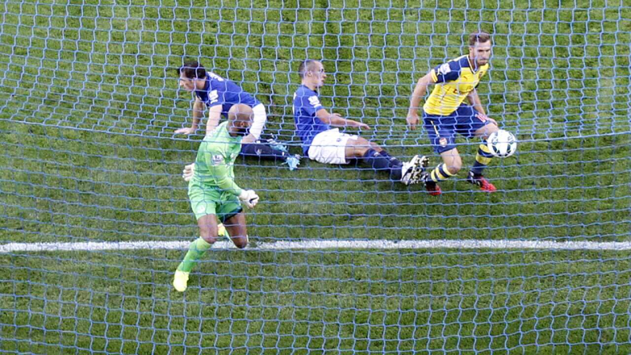 Arsenal's Aaron Ramsey scores his side's first goal