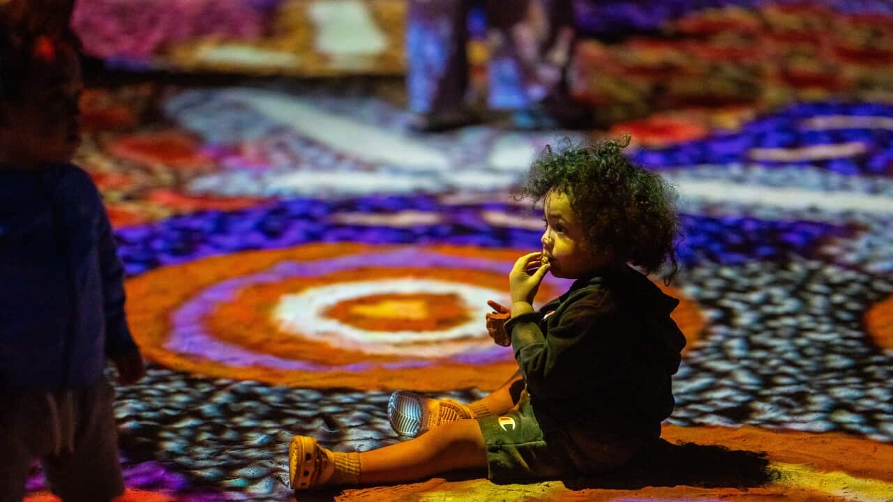 A child enjoys the Grounded installation by Keahanie Baker Tunkin Credit Parrtjima.jpg
