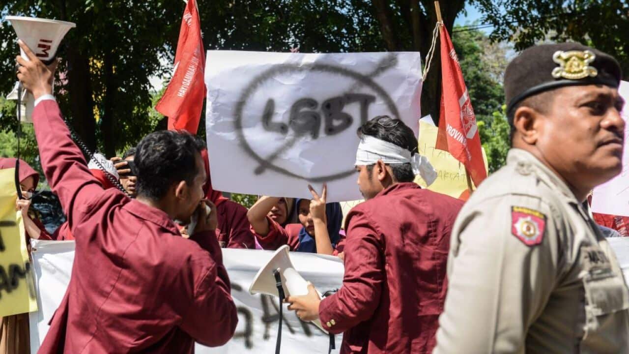 A group of Muslim protesters march with banners against the lesbian, gay, bisexual and transgender (LGBT) community in Banda Aceh in 2017.