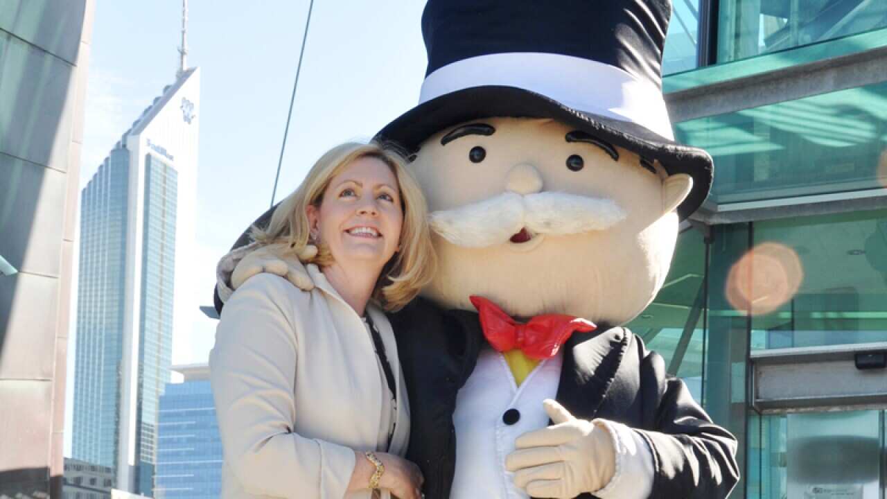 Perth mayor Lisa Scaffidi poses with Mr Monopoly