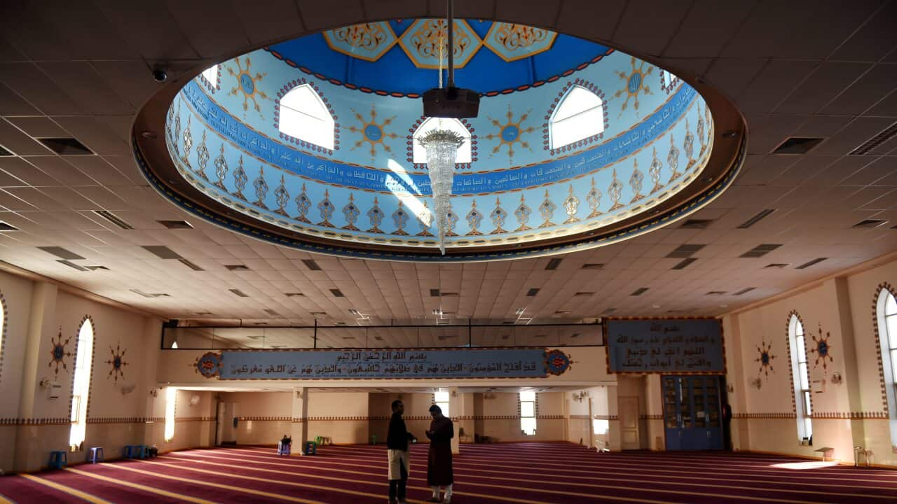 Men gather to pray at Lakemba Mosque in Sydney, Friday, Aug. 22, 2014. (AAP Image/Tracey Nearmy) NO ARCHIVING, EDITORIAL USE ONLY