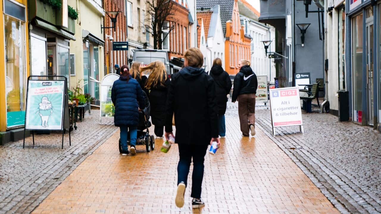 Young people stroll through Apenrade, Denmark.