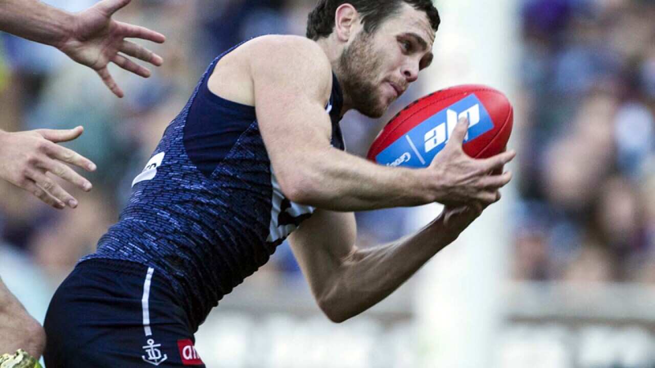 Hayden Ballantyne of the Fremantle Dockers scores against the Giants