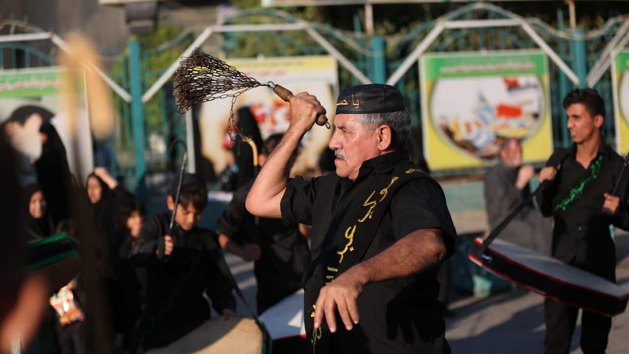An Iraqi Shiite Muslim flagellates himself to show his grief during preparations of the Muslim holiday of Ashoura