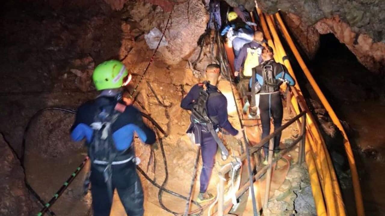 Royal Thai Navy rescuers entering the cave.