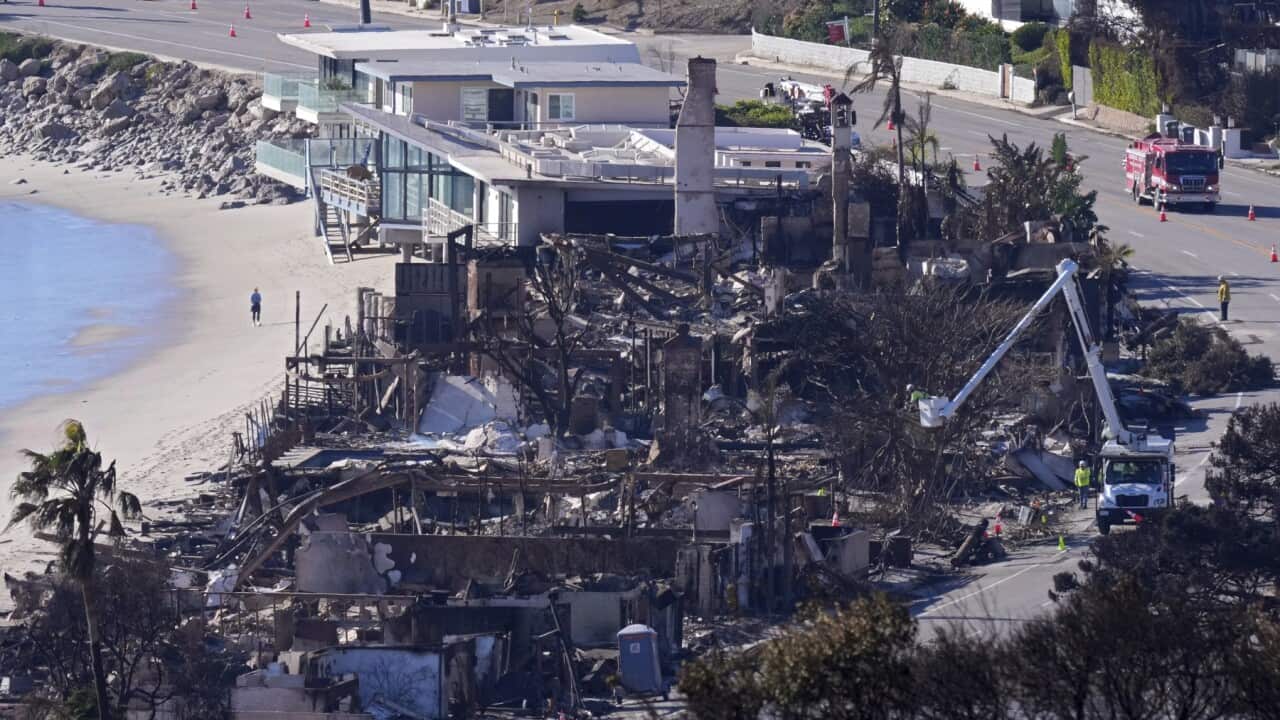 Homes along Pacific Coast Highway are seen burned and damaged while a few still stand after the Palisades Fire.