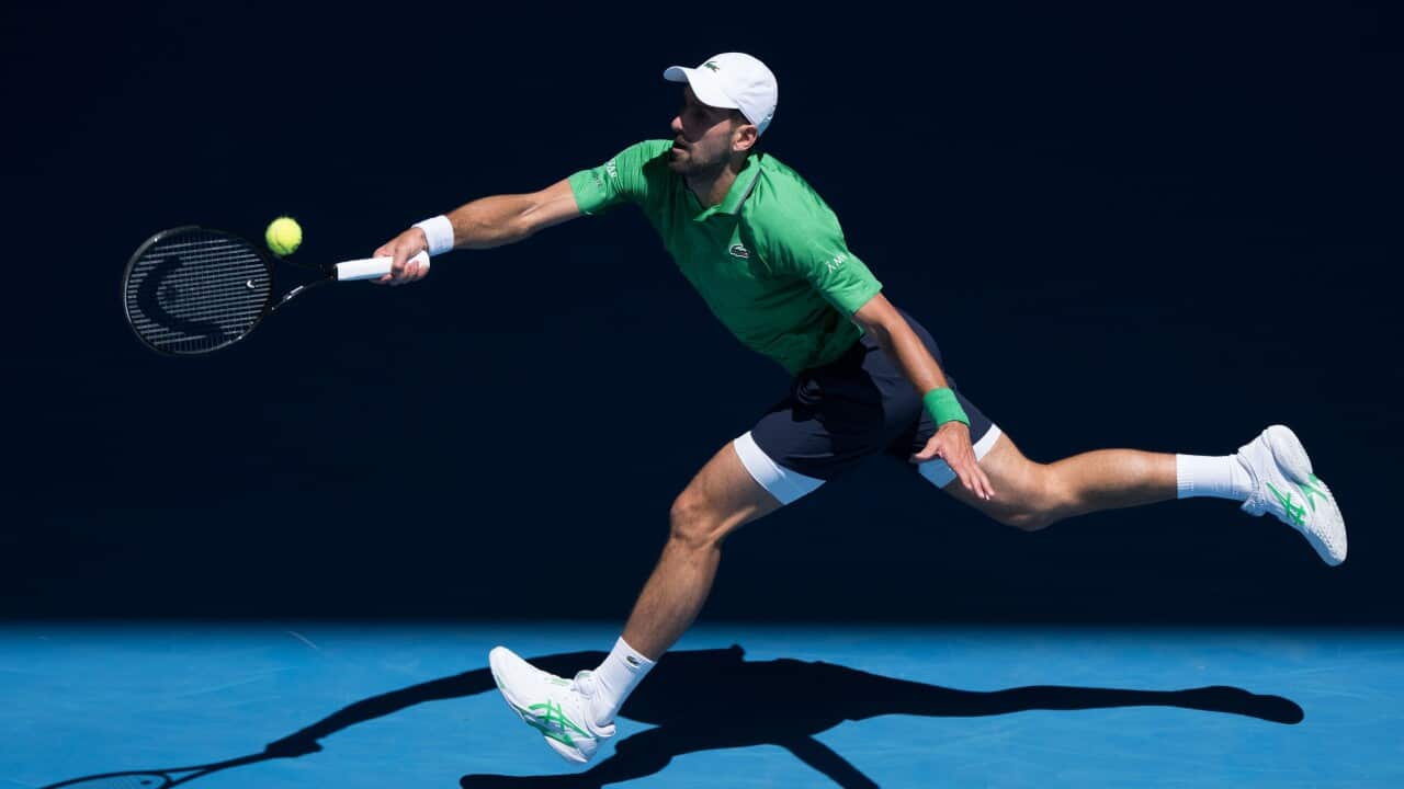 NOVAK DJOKOVIC of Serbia in action against FRANCESCO MAESTRELLI of Italy on Rod Laver Arena on day 5 of the 2026 Australian Open in Melbourne