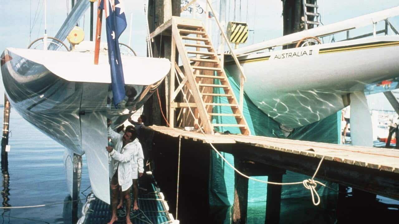 The Australian II Team shrouds the Australia 11's controversial keel from inspection