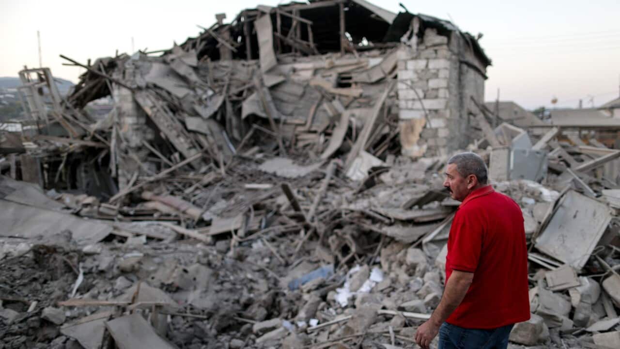 STEPANAKERT, NAGORNO-KARABAKH - OCTOBER 17, 2020: A local resident examines the ruins of a residential house destroyed in a shelling attack.
