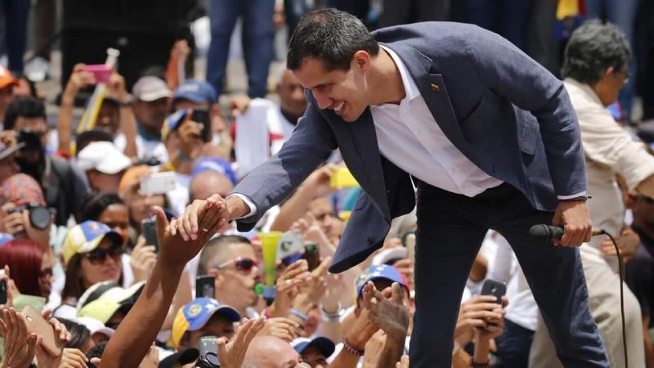 Juan Guaido greets supporters in Caracas.