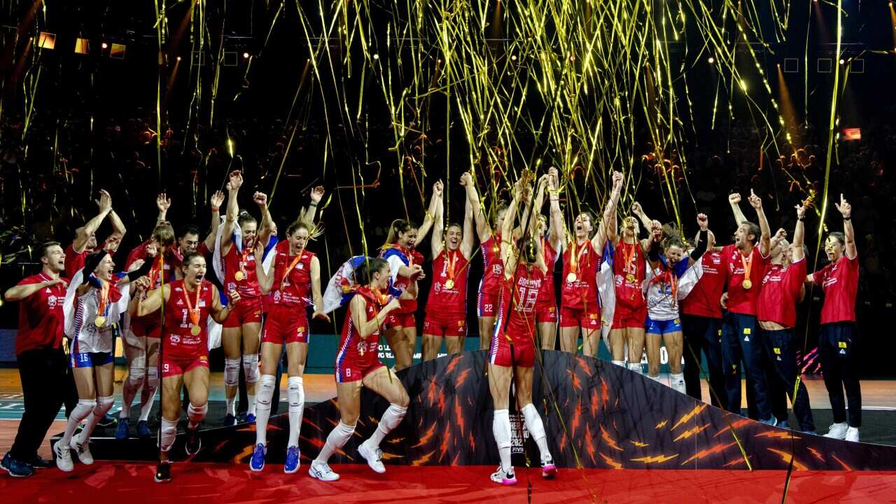 The volleyball women's team of Serbia celebrates winning the final match at the 2022 World Championship against Brazil in Apeldoorn