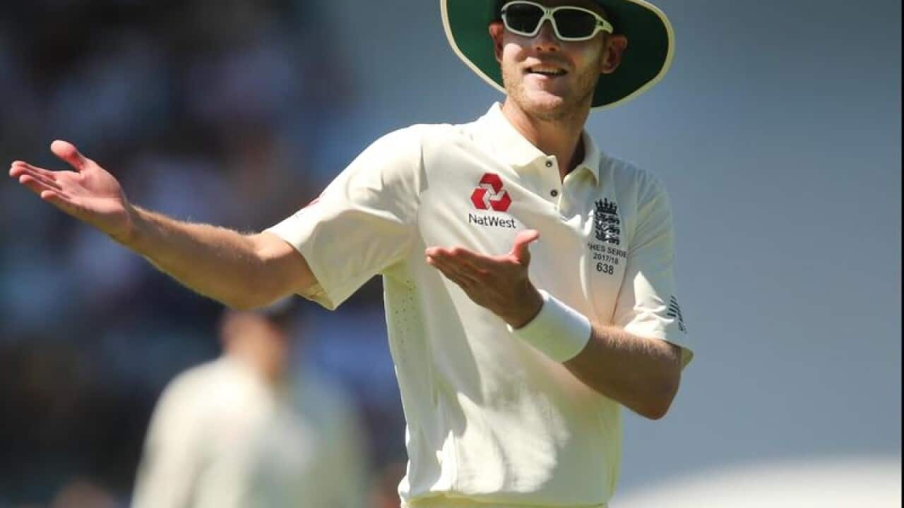 Stuart Broad gestures to fans.