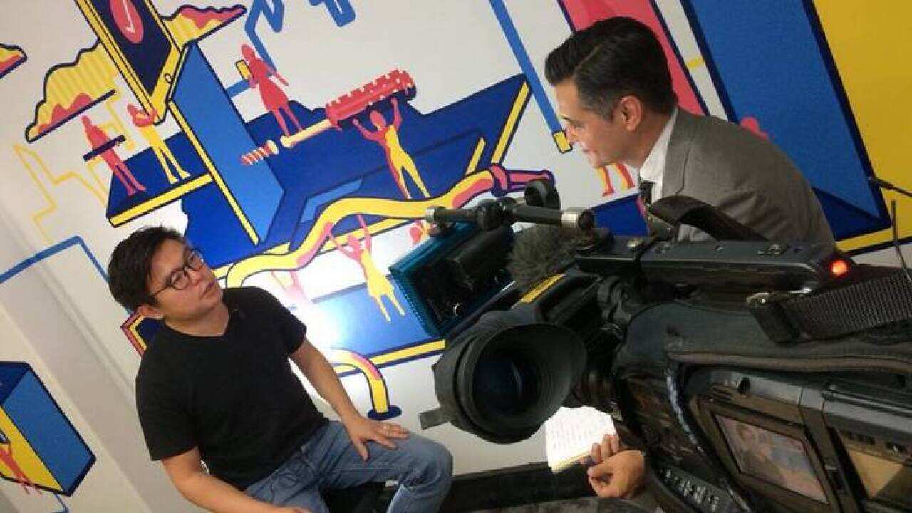 Airtasker co-founder Tim Fung (L) talks to Ricardo Goncalves (SBS)