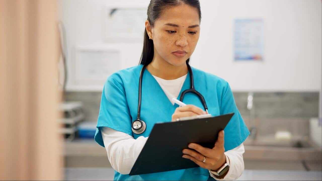 Asian woman, vet and writing with clipboard for results on animal medicine, study or diagnosis at clinic. Young female person or veterinarian taking notes for medical prescription or pet treatment