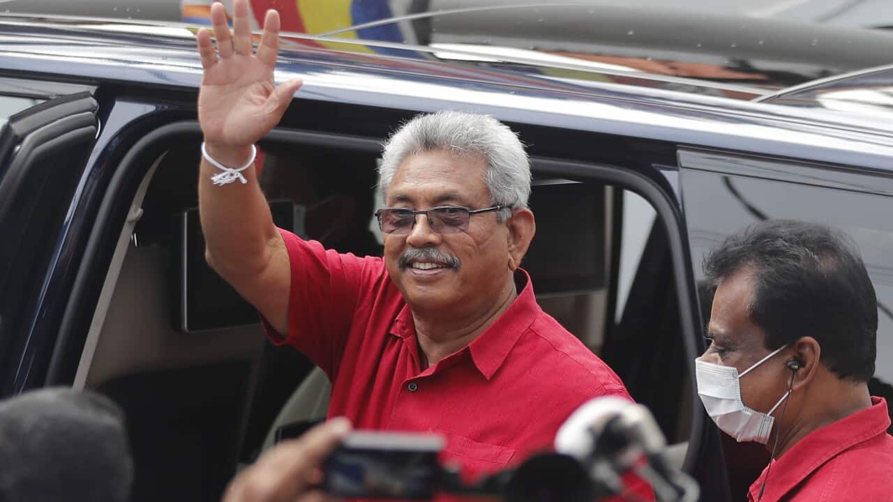 Sri Lankan president Gotabaya Rajapaksa waves after casting his vote during the parliamentary election in Colombo, Sri Lanka