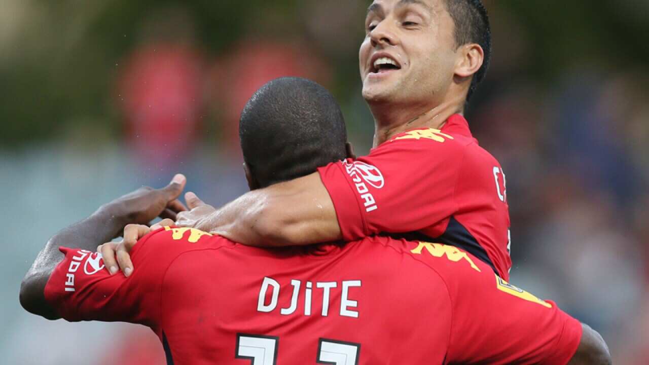 Marcelo Carrusca of Adelaide United reacts with team mate