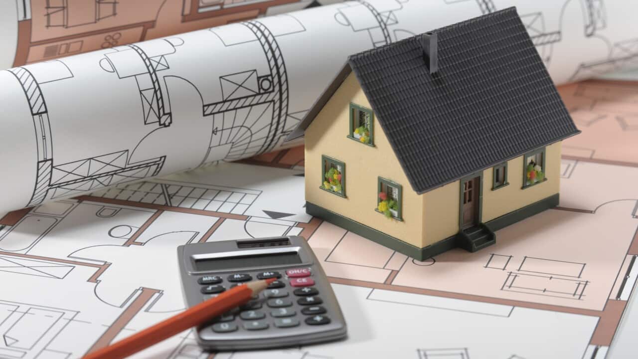 model home on architectural construction plan